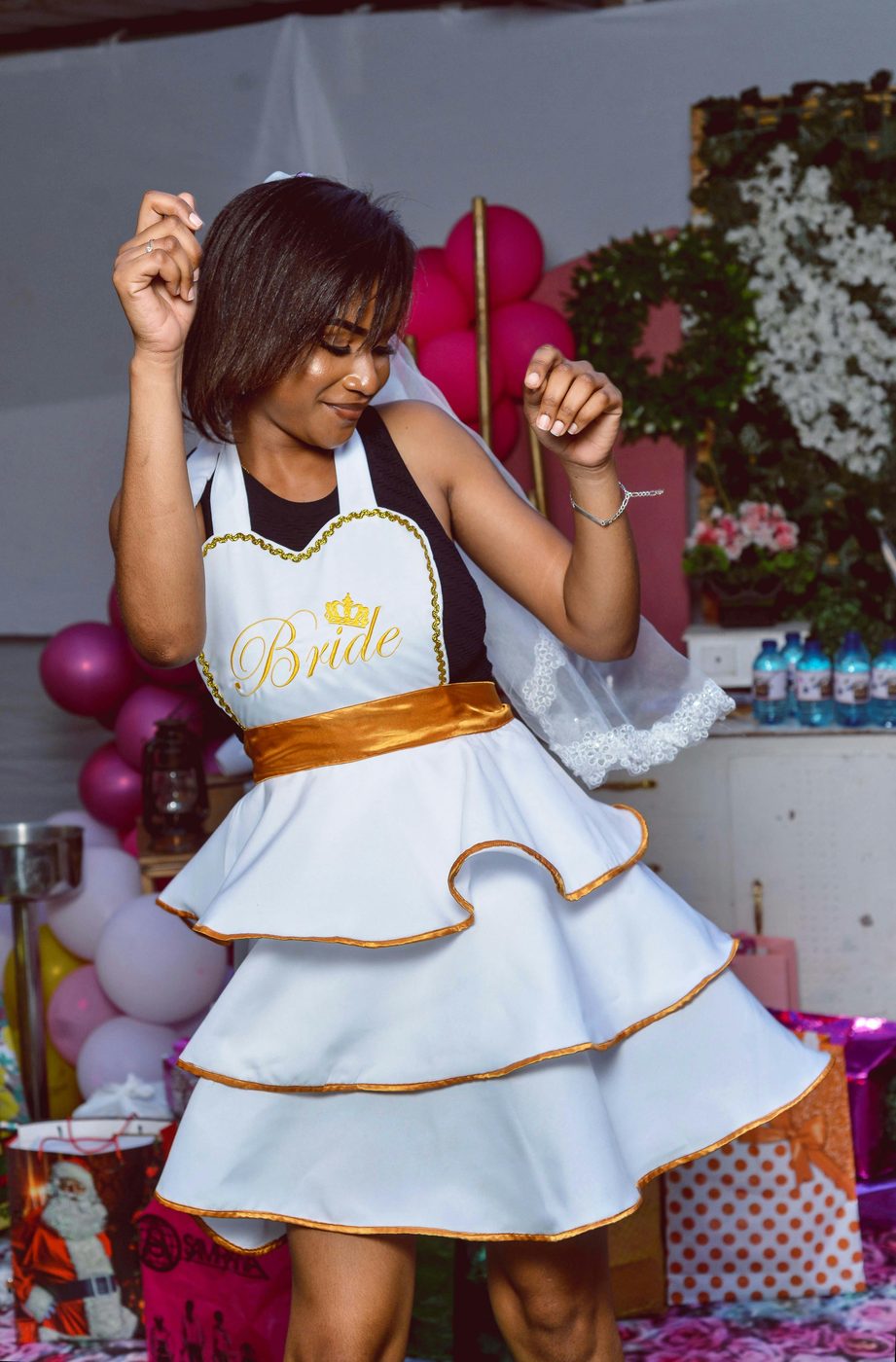 A bride celebrating, dancing at her party